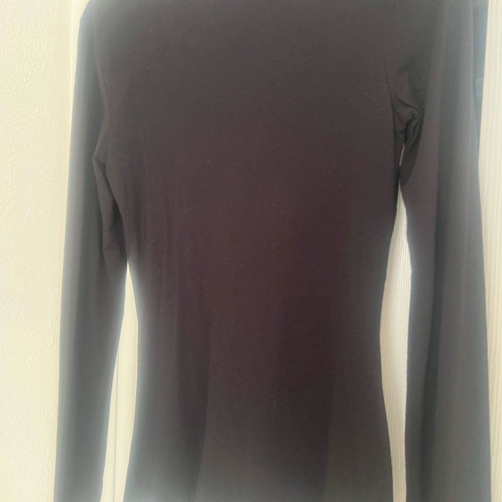 Beautiful never worn top. Perfect for the upcoming holidays.